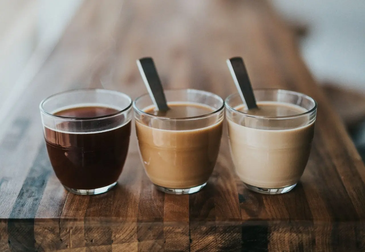 macro photography of three assorted liquids